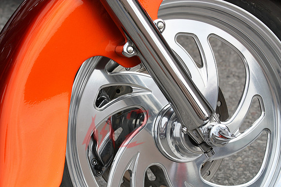Orange Motorcycle Brake Disc Close-Up